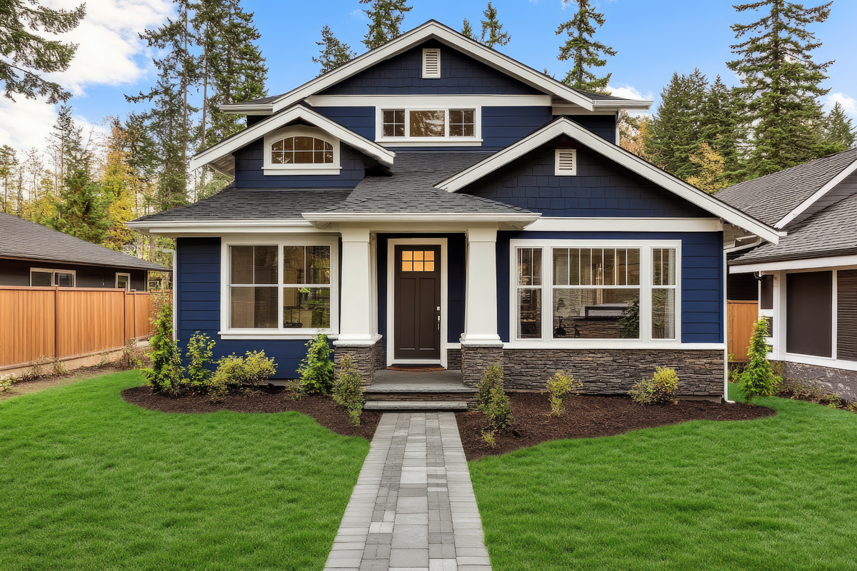 Blue Craftsman home with large energy-efficient windows